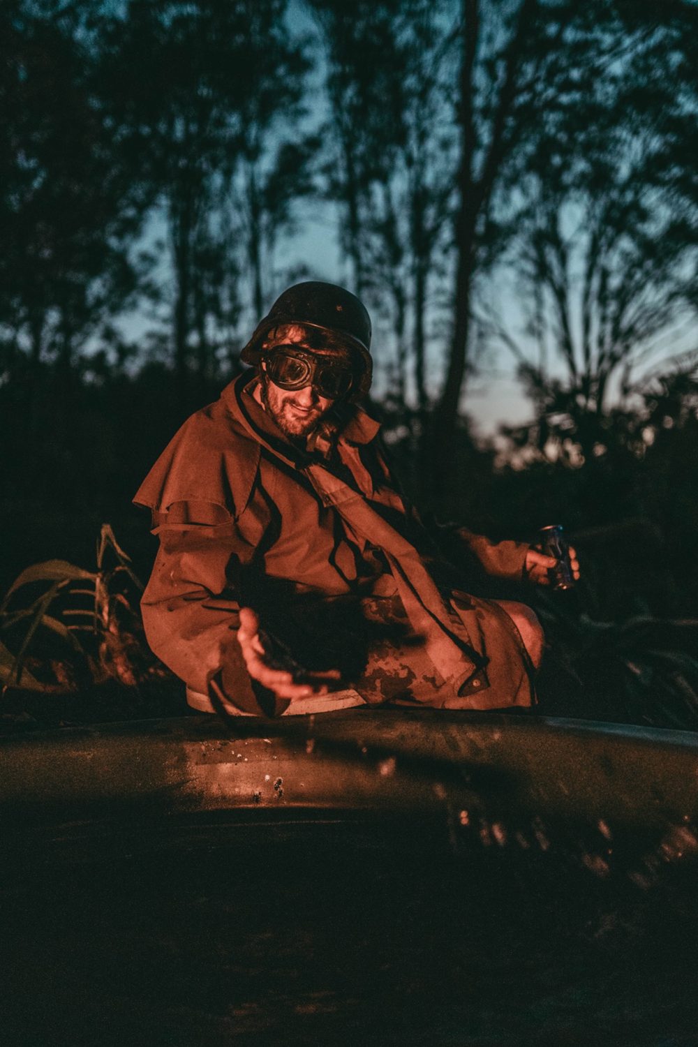 Pete taking a quiet break at camp, still wearing his helmet, goggles and coat.